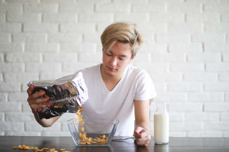 Corn flakes with milk for breakfastの写真素材