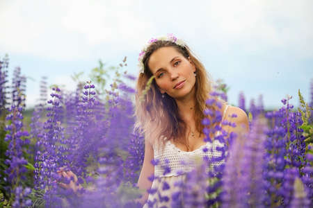 Girl with a bouquet of blue flowersの写真素材