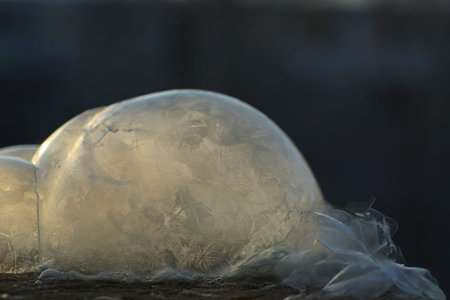 Soap bubbles freeze in the cold. Winter soapy water freezes in air.