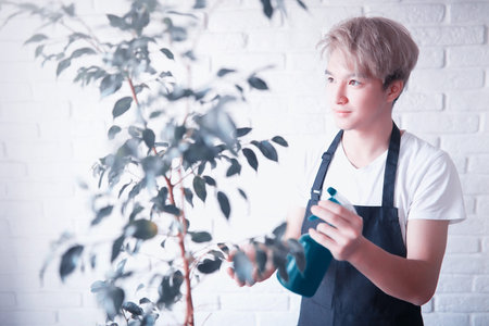 Young Asian boy takes care of plants