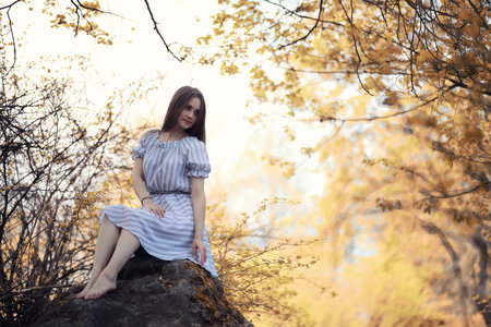 Young girl on a walk in the autumnの写真素材