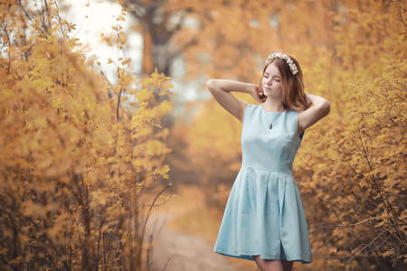 Young girl on a walk in the autumnの写真素材