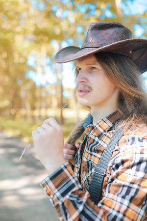 Man with guitar in autumn day