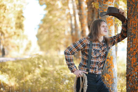 Man with guitar in autumn dayの写真素材