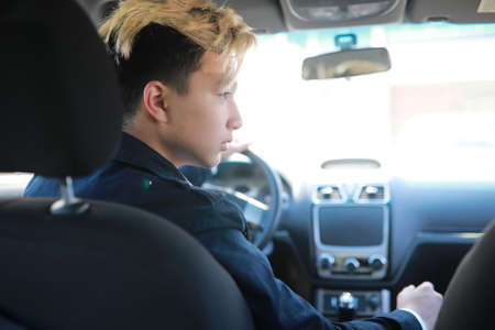 Man with car in the streetの写真素材