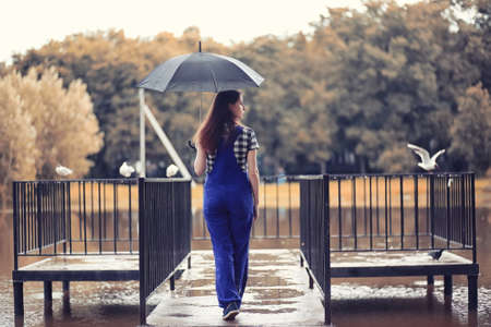 Young girl in autumn parkの写真素材