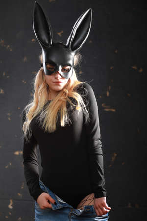 A girl in a black maskの写真素材