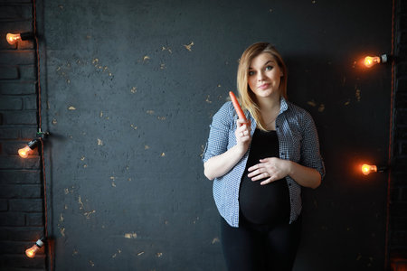 Pregnant young beautiful girl on the ninth monthの写真素材