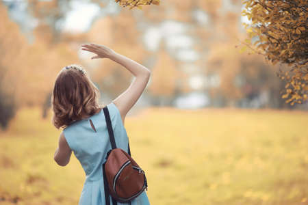 Young girl on a walk in the autumnの写真素材