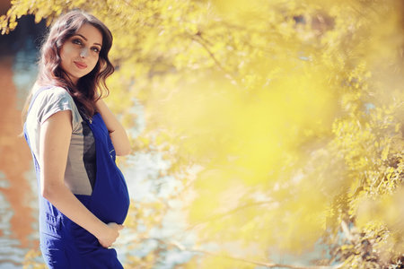 Pregnant woman on a walk in the park