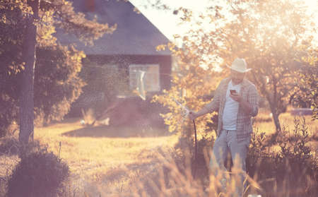 Man farmer watering a vegetable gardenの写真素材