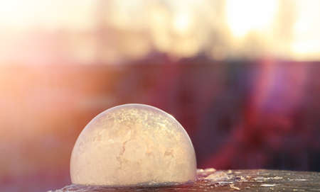 Soap bubbles freeze in the cold. Winter soapy water freezes in air.の写真素材