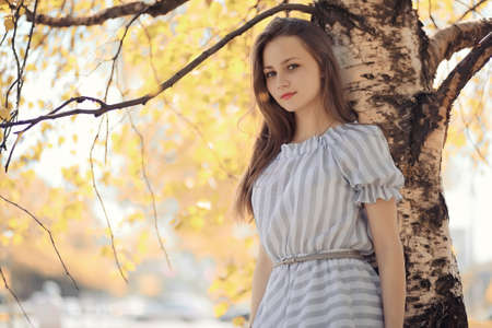 Young girl on a walk in the autumnの写真素材
