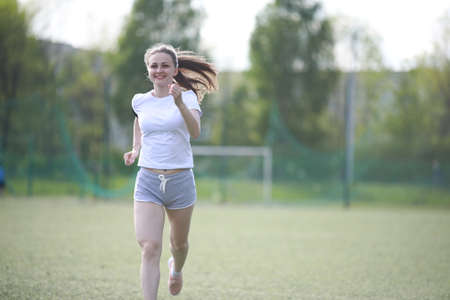 Girl and sport lifestyle doing exercisesの写真素材