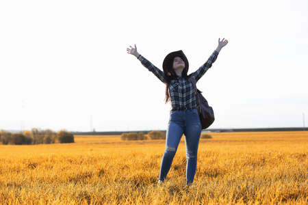 A young girl is traveling around the city hitchhiking. A beautifの写真素材