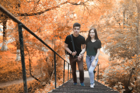 Young couple on a walk in autumn park