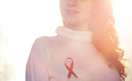The red ribbon of the girl. The girl is holding a red ribbon. Heの写真素材