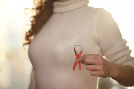 The red ribbon of the girl. The girl is holding a red ribbon. Heの写真素材
