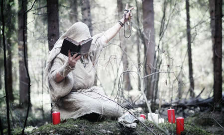 Fairy magician. A sorcerer with a glass sphere, a magical spellの写真素材