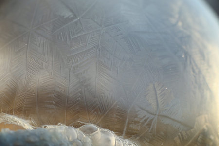 Soap bubbles freeze in the cold. Winter soapy water freezes in t