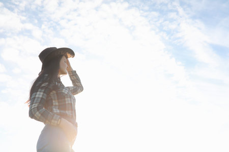 A young girl is traveling around the city hitchhiking. A beautif