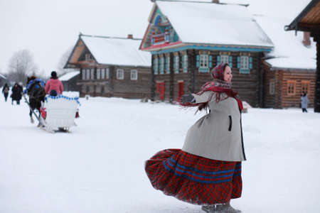 young girls in traditional costumes of the Russian north in wintの写真素材