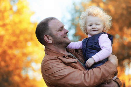 Girl walking in the autumn park.の写真素材