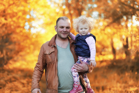Girl walking in the autumn park.の写真素材