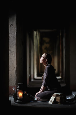 A girl with old books in the old house