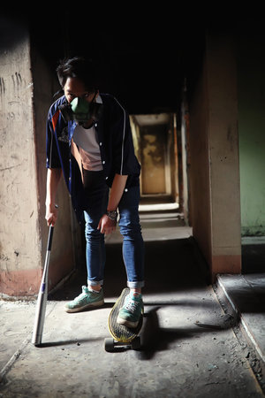 A young person with a baseball bat