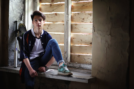 A young person with a baseball bat