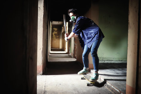 A young person with a baseball bat