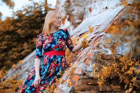 Girl in the street with an umbrellaの写真素材
