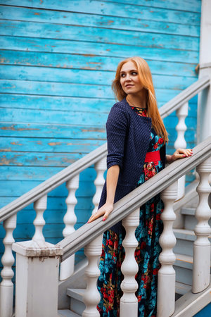 Girl in the street with an umbrellaの写真素材
