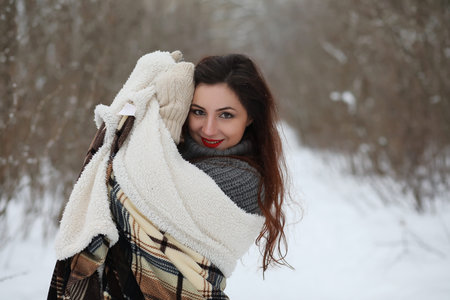 Beautiful girl in a beautiful winter park