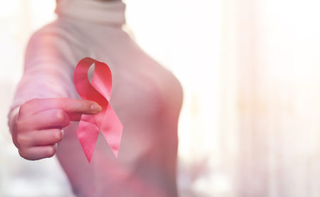 The red ribbon of the girl. The girl is holding a red ribbon. He