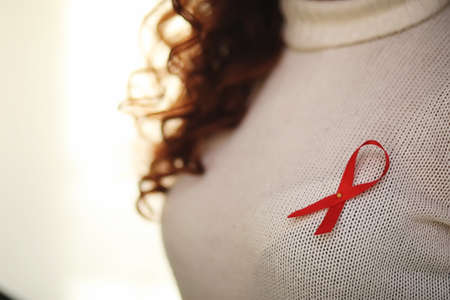 The red ribbon of the girl. The girl is holding a red ribbon. Heの写真素材