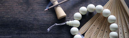 Different objects with traditional religious oriental on a wooden backgroundの写真素材