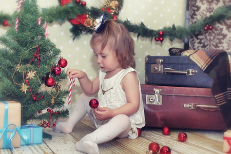 little girl and Christmas tree