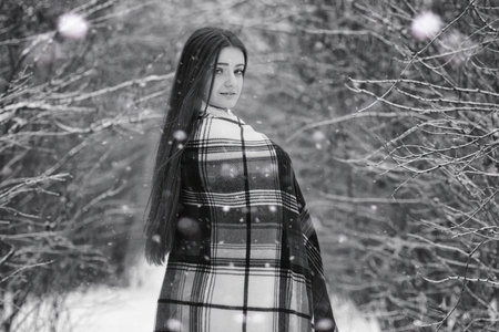 A girl in a winter cloudy day