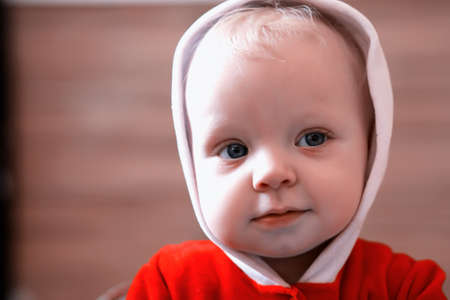 Portrait of a young blond child with blue eyesの写真素材