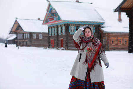 young girls in traditional costumes of the Russian north in winterの写真素材