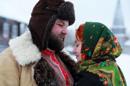 Couple in traditional winter costume of peasant in russiaの写真素材