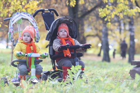 A young kids in a park walk