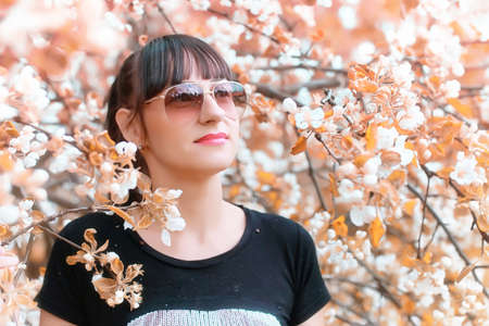 Beautiful girl in the autumn parkの写真素材
