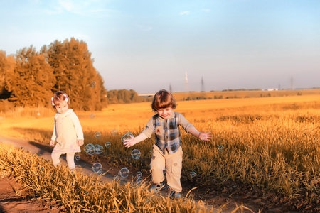 Children outdoors in a fieldの写真素材