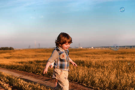 Children outdoors in a fieldの写真素材