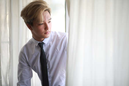 Young Asian businessman in white shirt and tieの写真素材