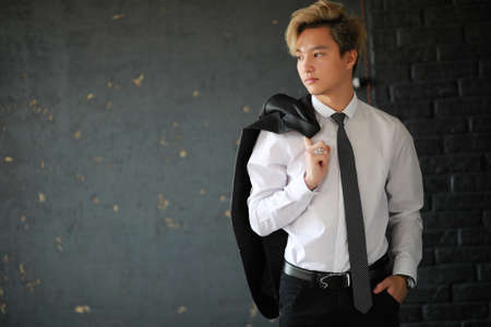 Young Asian businessman in white shirt and tieの写真素材