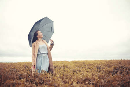 Young girl in autumn parkの写真素材